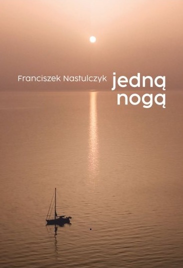 Okładka tomu wierszy Franciszka Nastulczyka pod tytułem „Jedną nogą”.